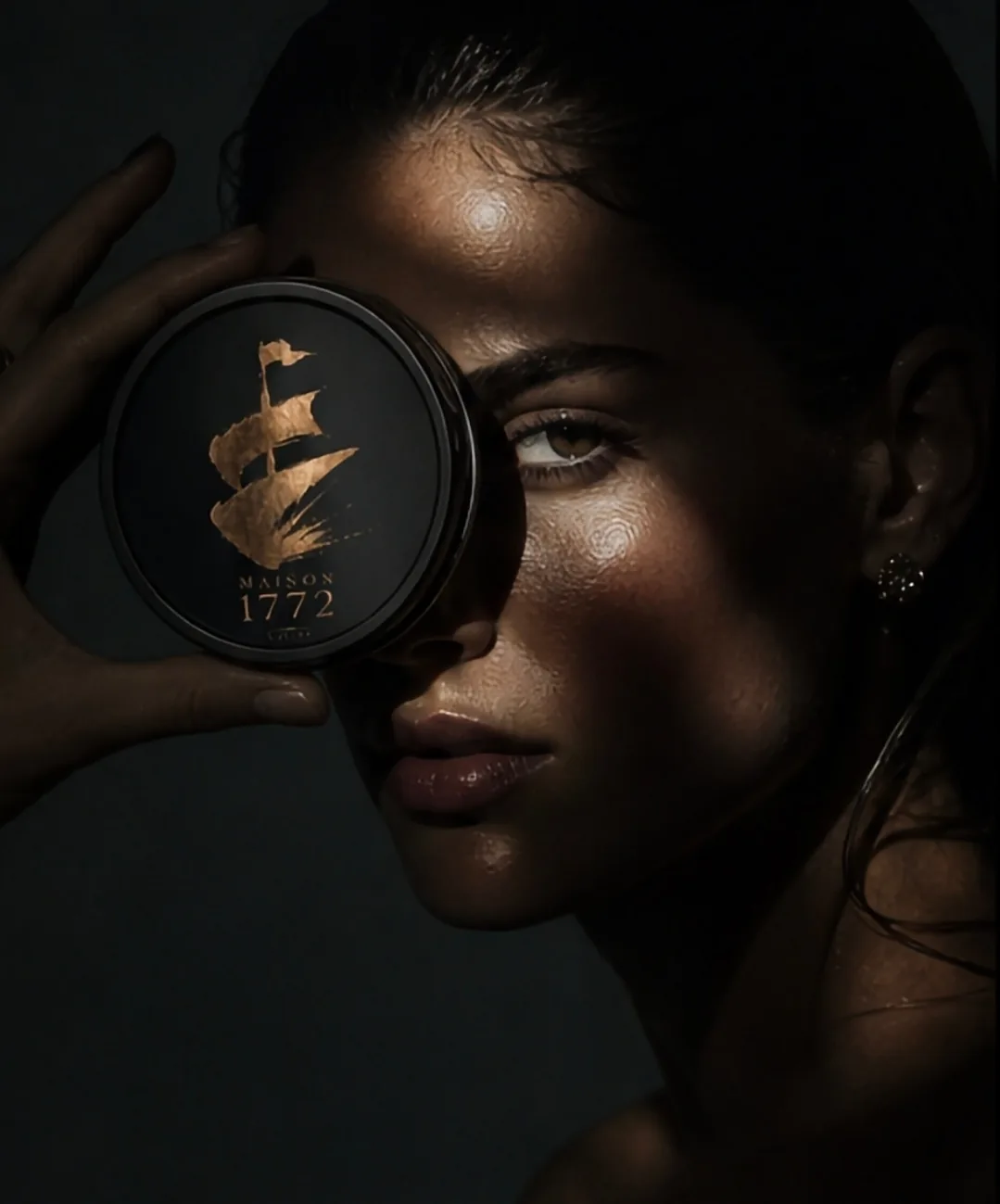 Woman holding a Maison 1772 caviar tin over her eye